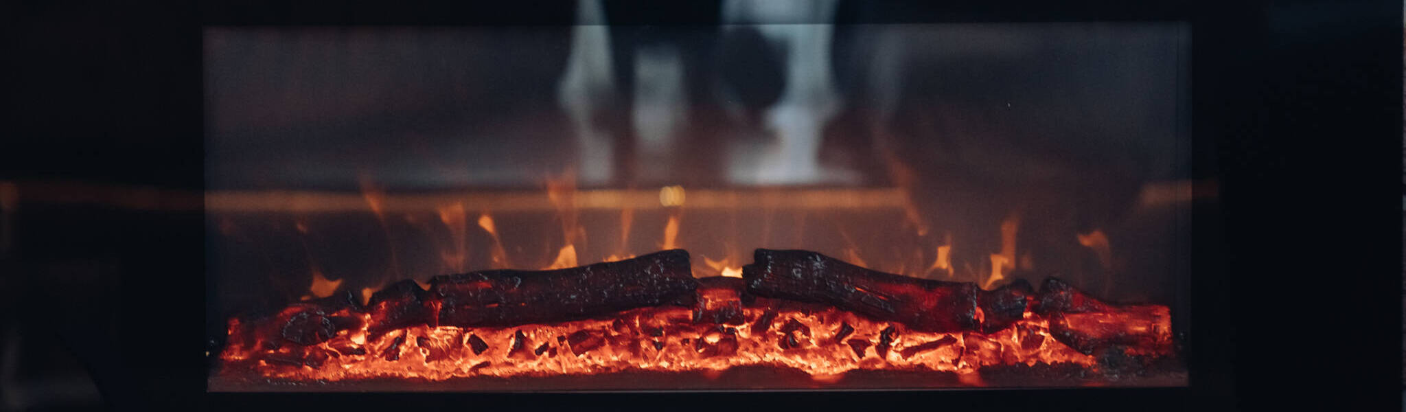Fireplace With Burning Logs. Close Up Of Stony Fireplace With Burning Or Smoldering Logs On Fire.
